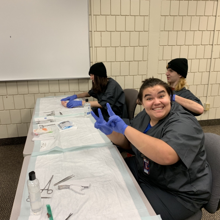 Happy, smiling student learning medical procedures. 