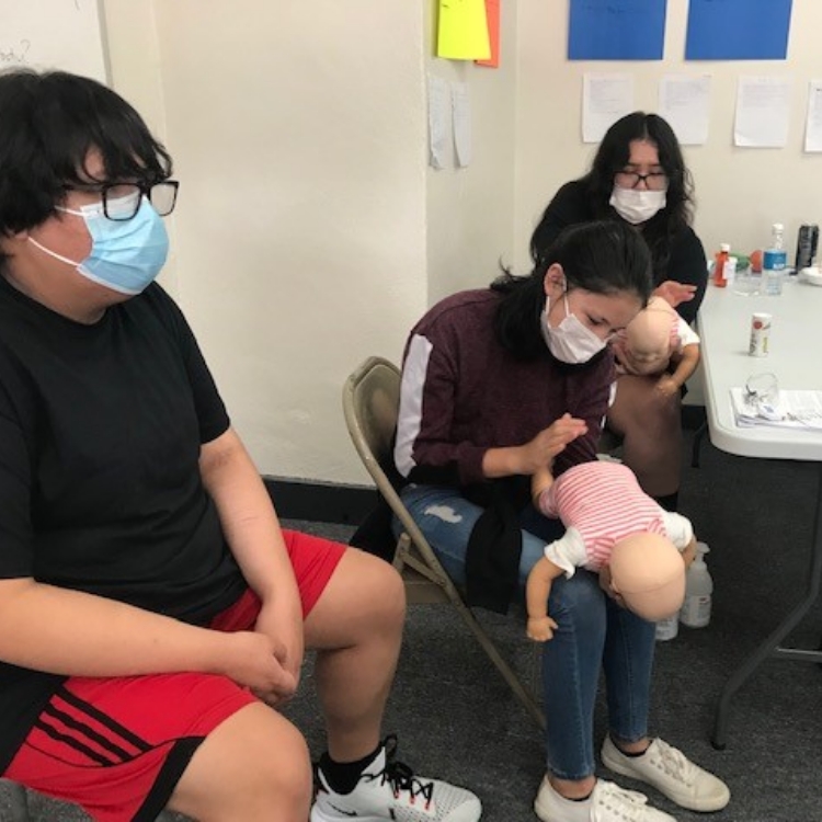 Youth learning in a healthcare program.